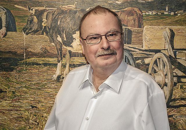 Reinacher Lyriker: Rudolf Waldmann vor einer Reproduktion von Giovanni Segantinis «An der Tränke» von 1888, einem der Lieblingsbilder seiner Frau. Foto: Thomas Brunnschweiler